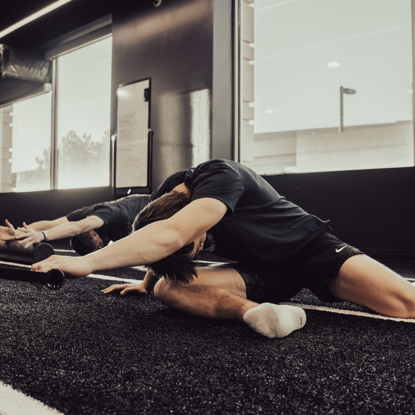 Athletes stretching during a training session